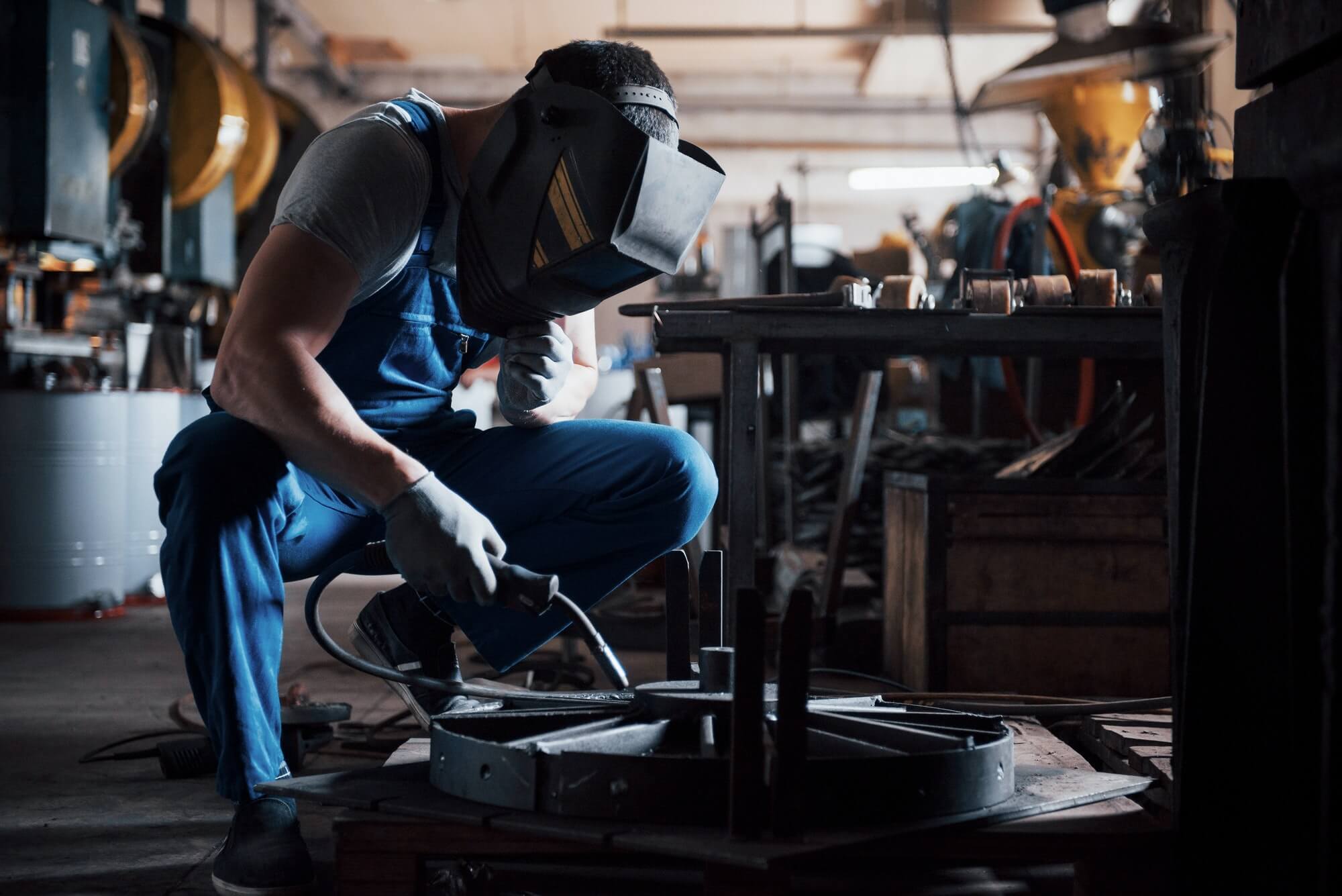 portrait-of-a-young-worker-at-a-large-metalworking-plant-the-welder-engineer-works-in-a-protective-1.jpg